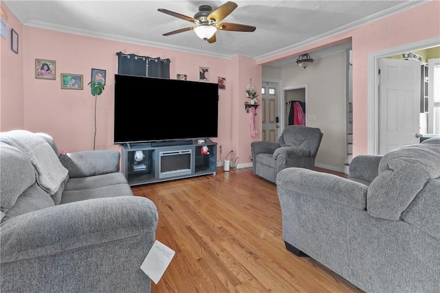 70 Perkins Ave, Cranston, RI 02910 - living area with baseboards, ceiling fan, ornamental molding, and light wood-type flooring