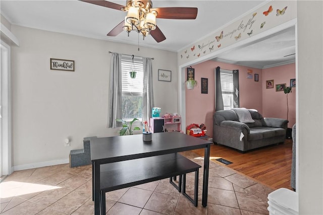 70 Perkins Ave, Cranston, RI 02910 - dining room featuring light tile patterned floors, plenty of natural light, ceiling fan, and crown molding