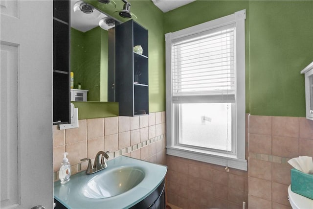 70 Perkins Ave, Cranston, RI 02910 - bathroom featuring vanity, wainscoting, and tile walls
