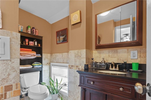 70 Perkins Ave, Cranston, RI 02910 - bathroom with vanity, toilet, and tile walls