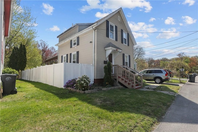 70 Perkins Ave, Cranston, RI 02910 - view of property exterior featuring fence, a yard, and driveway