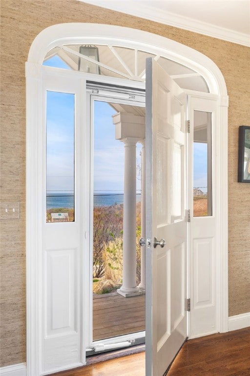 244 Spring St, Block Island, RI 02807 - entryway featuring baseboards, a water view, and wood finished floors