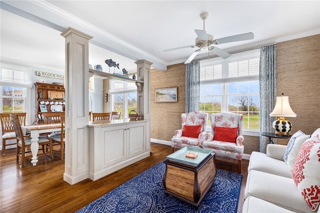 244 Spring St, Block Island, RI 02807 - living area with ornate columns, wallpapered walls, a ceiling fan, and a wealth of natural light