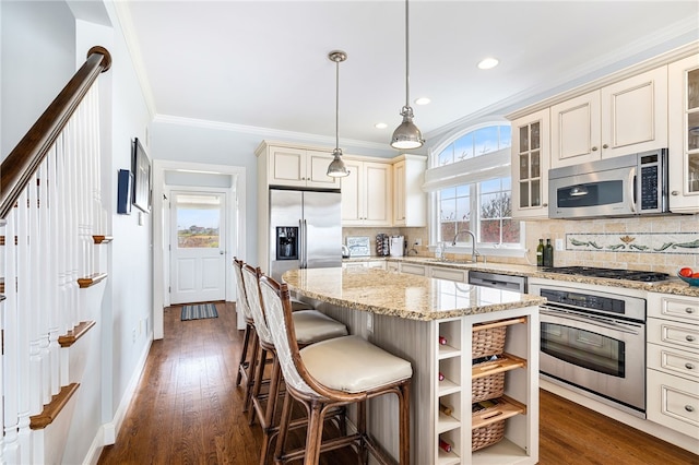 244 Spring St, Block Island, RI 02807 - kitchen featuring cream cabinets, stainless steel appliances, and backsplash
