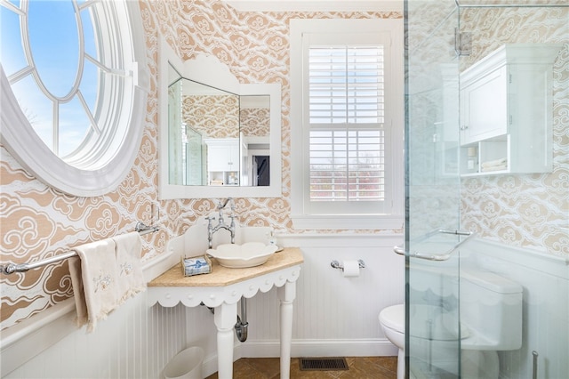244 Spring St, Block Island, RI 02807 - full bathroom featuring visible vents, a wealth of natural light, toilet, and wallpapered walls