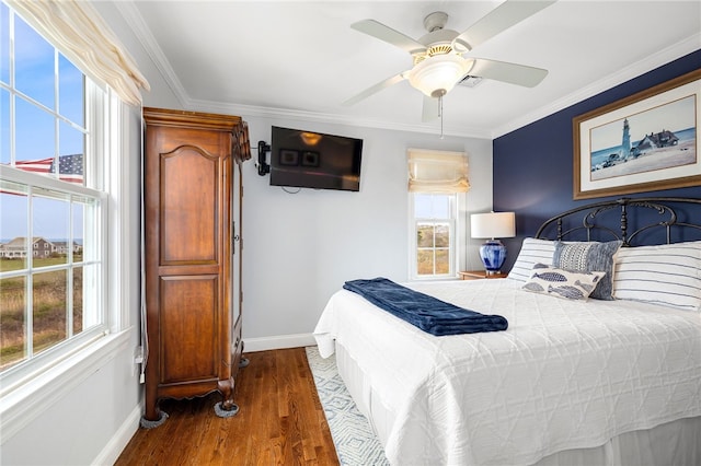 244 Spring St, Block Island, RI 02807 - bedroom with baseboards, multiple windows, ornamental molding, and wood finished floors