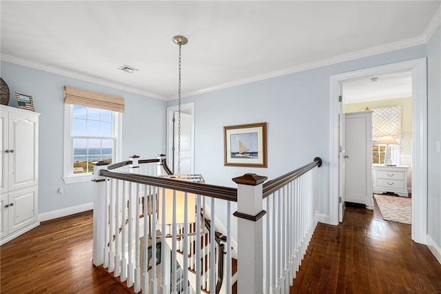 244 Spring St, Block Island, RI 02807 - hallway featuring baseboards, dark wood-style flooring, crown molding, and an upstairs landing