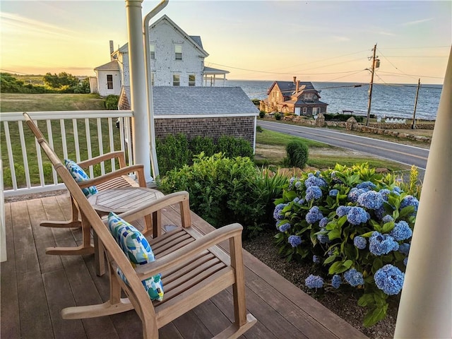 244 Spring St, Block Island, RI 02807 - deck at dusk featuring a water view