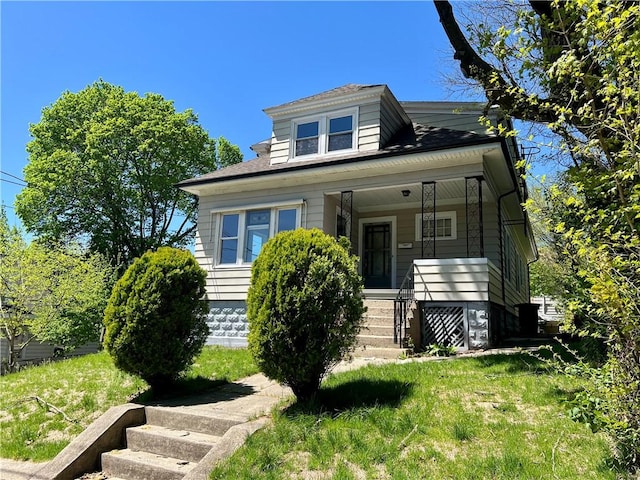 bungalow-style home with a porch and stairway