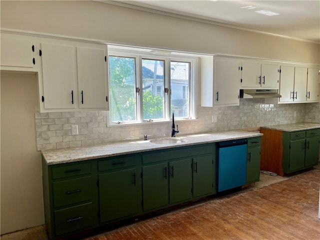 kitchen featuring decorative backsplash, green cabinetry, white cabinetry, under cabinet range hood, and dishwasher