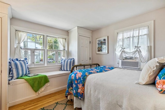 bedroom with wood finished floors