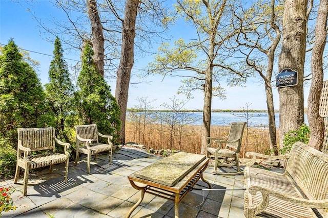 view of patio / terrace featuring a water view