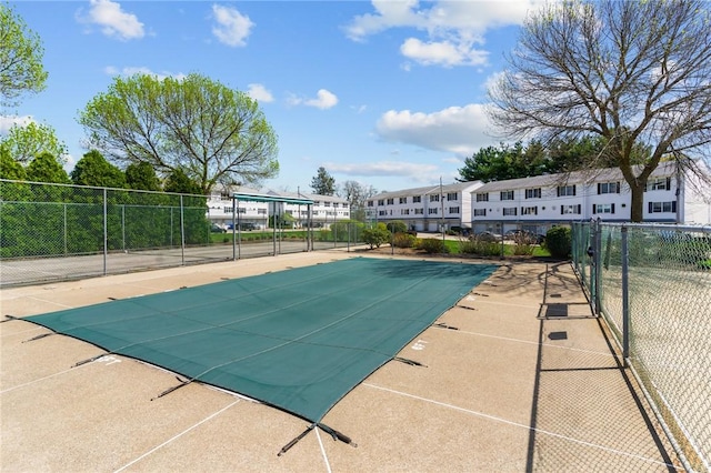 view of pool featuring fence