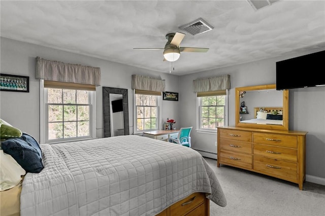 bedroom featuring visible vents, baseboards, ceiling fan, and light colored carpet