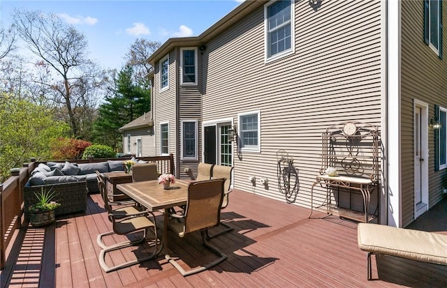 wooden deck featuring an outdoor living space and outdoor dining space