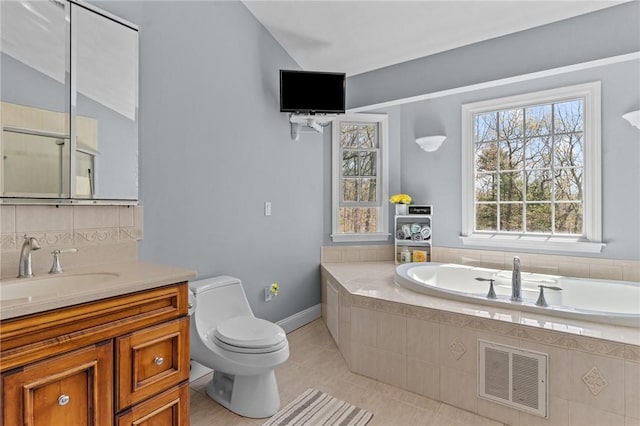 bathroom with visible vents, tile patterned flooring, vanity, toilet, and a bath