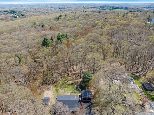 drone / aerial view featuring a view of trees