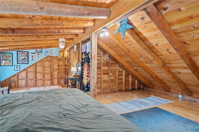 unfurnished bedroom with wood-type flooring, wooden walls, wooden ceiling, and vaulted ceiling with beams