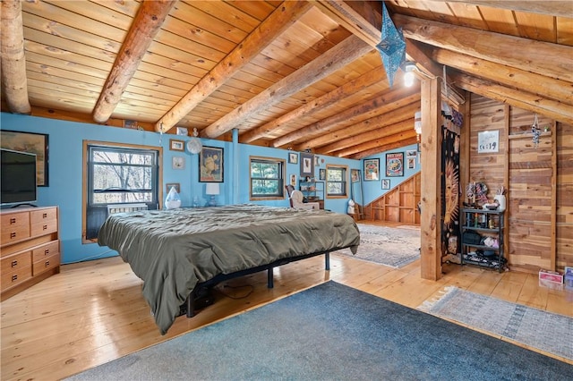 bedroom with wooden ceiling and light wood-style floors