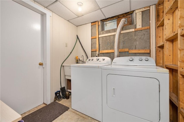 laundry room featuring a sink and washer and dryer