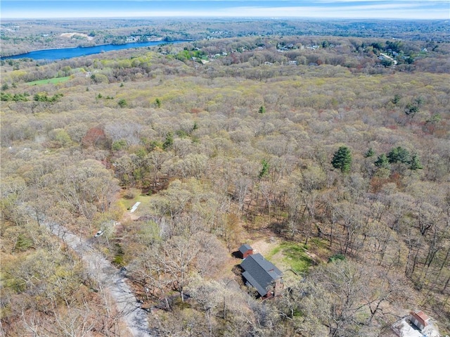bird's eye view with a water view and a view of trees