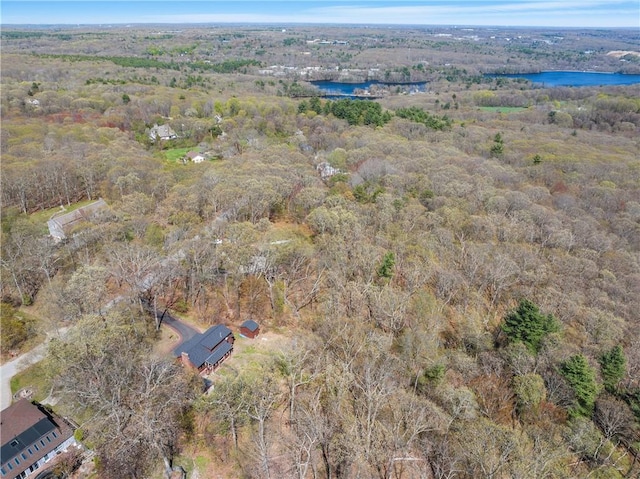 aerial view featuring a water view and a forest view
