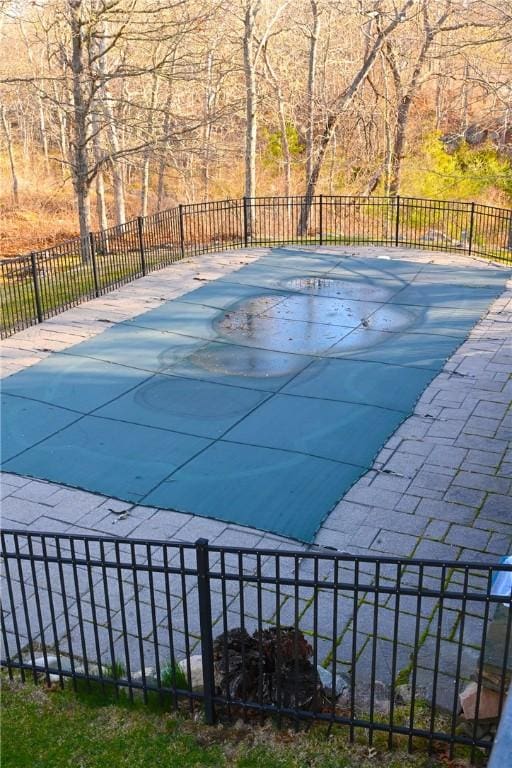 view of pool with fence