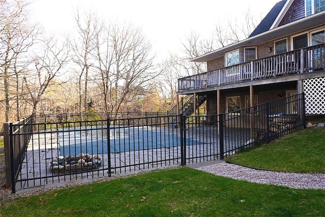 view of pool with fence, a deck, a patio, stairs, and a fenced in pool