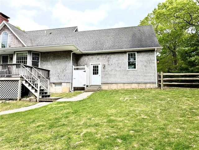 56 Ocean Ridge Dr, Charlestown, RI 02813 - rear view of property featuring entry steps, a shingled roof, and a wooden deck