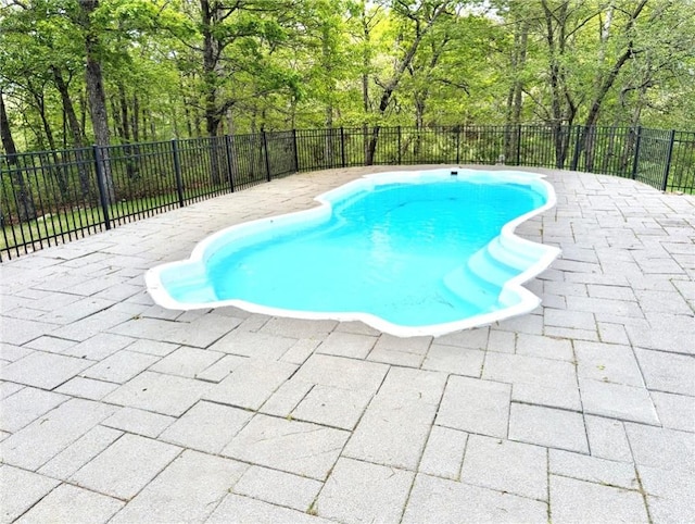56 Ocean Ridge Dr, Charlestown, RI 02813 - view of swimming pool with a patio area and fence