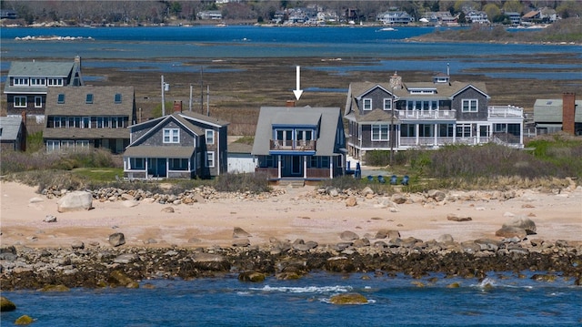 birds eye view of property with a water view