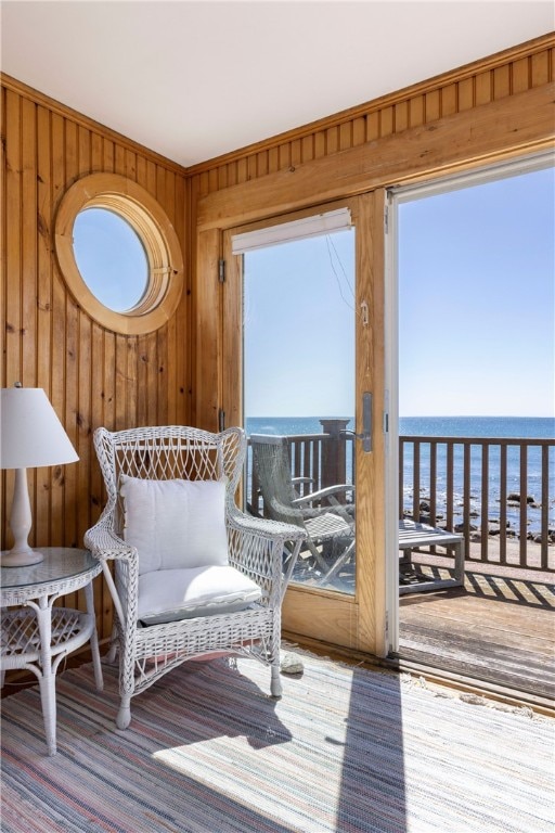 sunroom / solarium featuring a water view