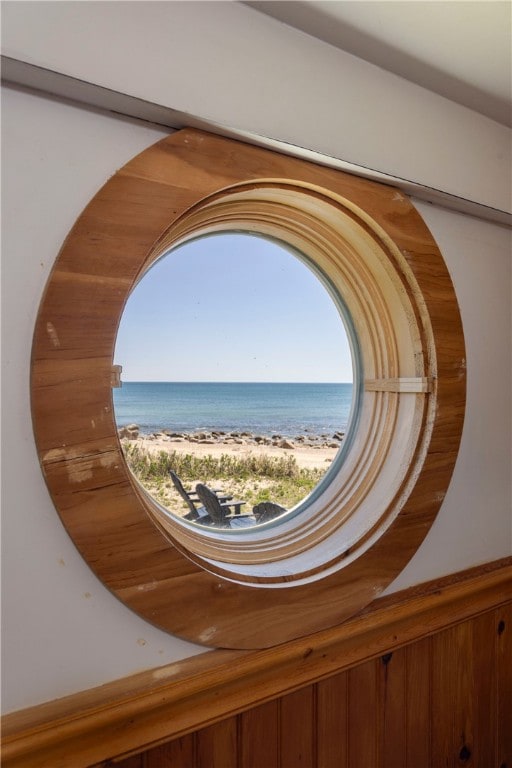 room details featuring a beach view and a water view
