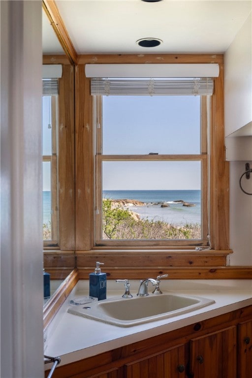 bathroom with vanity and a water view
