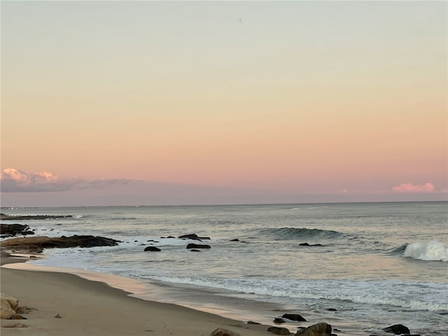 property view of water featuring a beach view