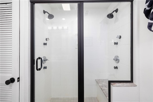 full bath featuring a shower stall