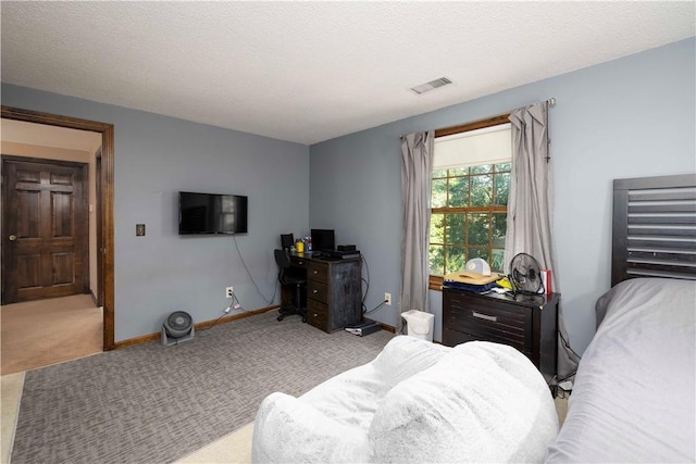 bedroom featuring baseboards, carpet flooring, and visible vents