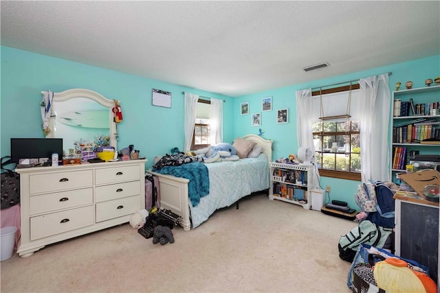 carpeted bedroom with visible vents
