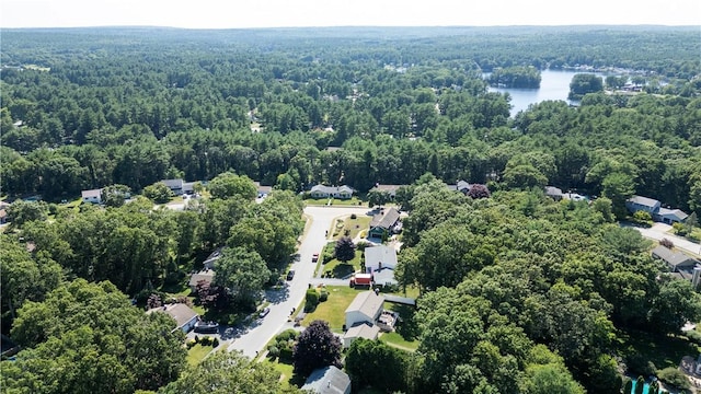 aerial view featuring a water view and a wooded view