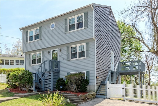 23 Oak Grove Blvd, North Providence, RI 02911 - colonial inspired home featuring fence, a deck, and stairway
