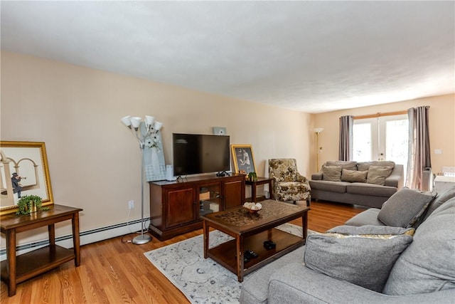 23 Oak Grove Blvd, North Providence, RI 02911 - living room featuring light wood-type flooring and a baseboard radiator