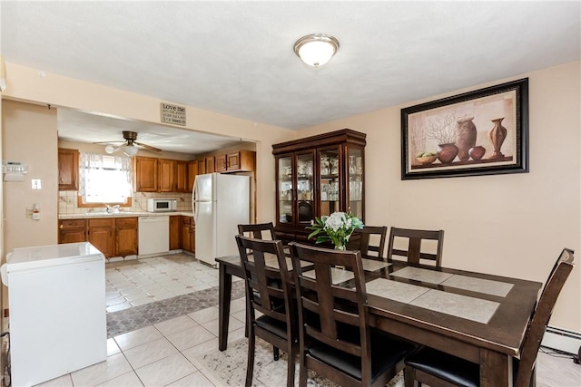 23 Oak Grove Blvd, North Providence, RI 02911 - dining area featuring a ceiling fan, light tile patterned flooring, visible vents, and baseboard heating