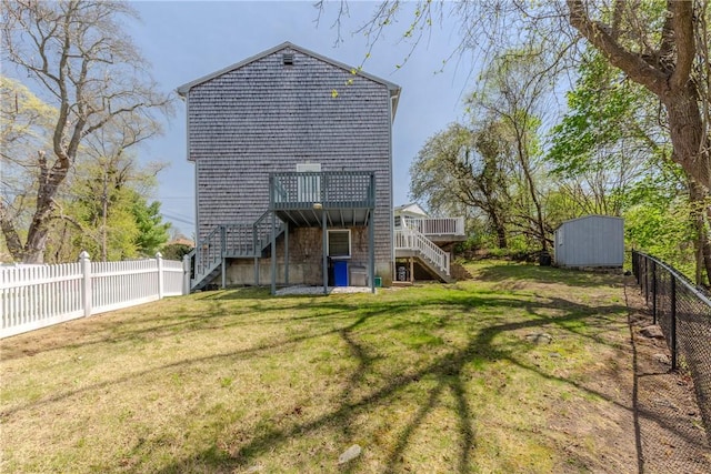 23 Oak Grove Blvd, North Providence, RI 02911 - back of property with a wooden deck, stairs, a fenced backyard, and a shed