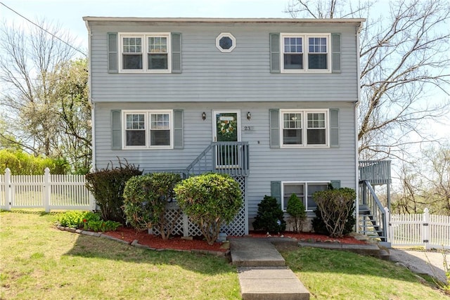 23 Oak Grove Blvd, North Providence, RI 02911 - colonial home featuring stairway, fence, and a front yard