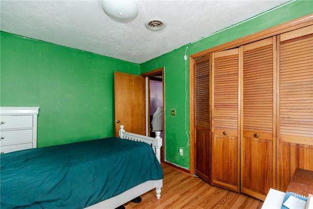 23 Oak Grove Blvd, North Providence, RI 02911 - bedroom with a closet, light wood finished floors, and visible vents