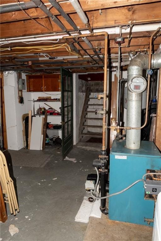 unfinished below grade area with stairs and a heating unit