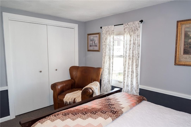 bedroom with a closet and carpet flooring