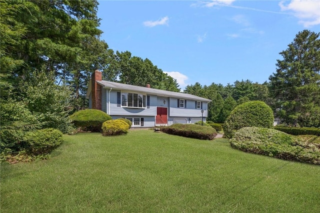 49 Magnolia Ln, Coventry, RI 02816 - raised ranch with a chimney and a front lawn