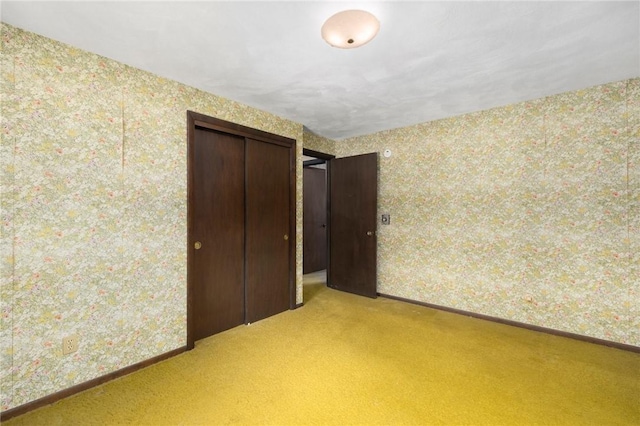 49 Magnolia Ln, Coventry, RI 02816 - interior space featuring carpet flooring, wallpapered walls, and baseboards