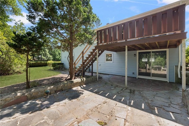 49 Magnolia Ln, Coventry, RI 02816 - rear view of house with a lawn, a patio area, a wooden deck, and stairway